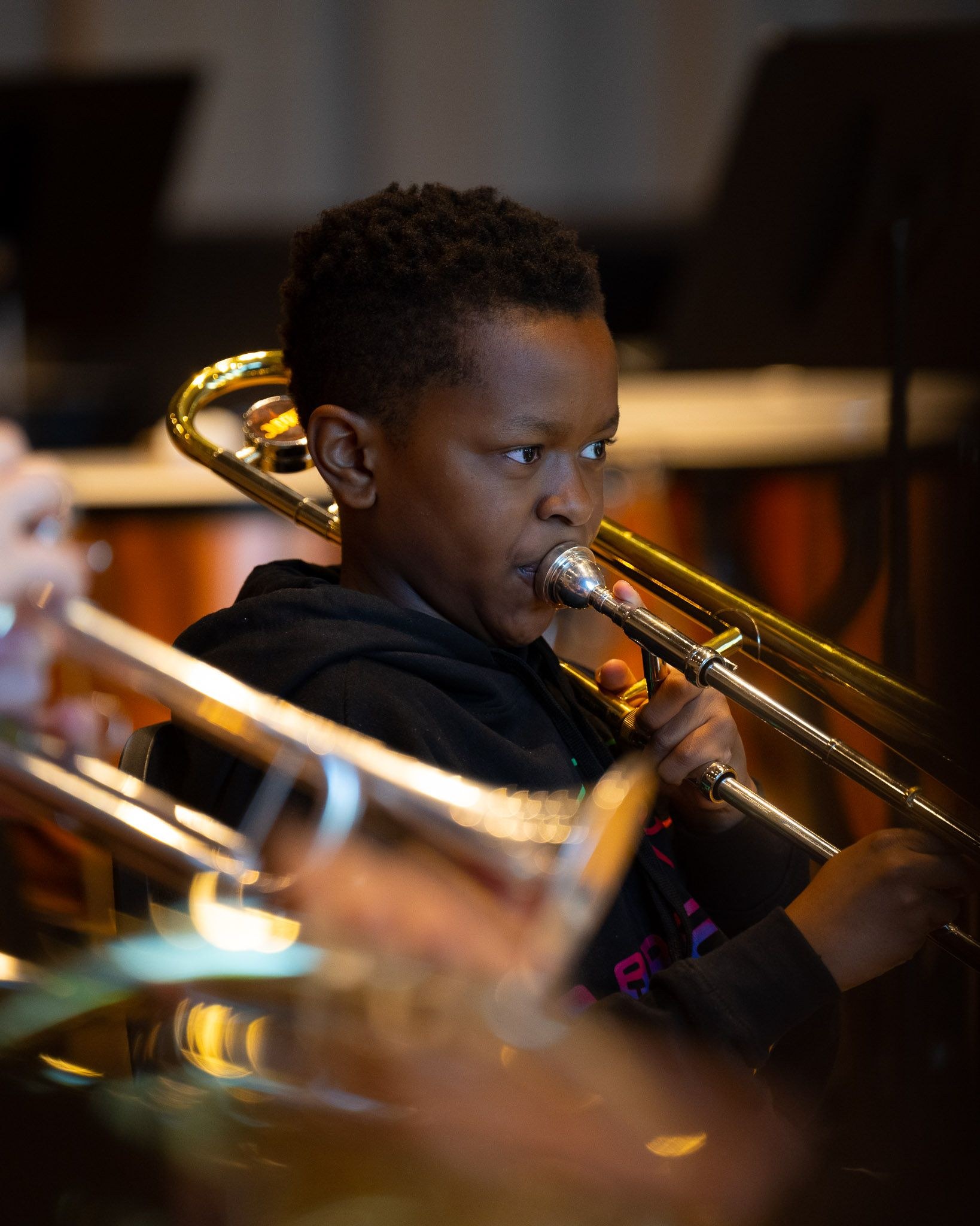 young child playing the trumpet