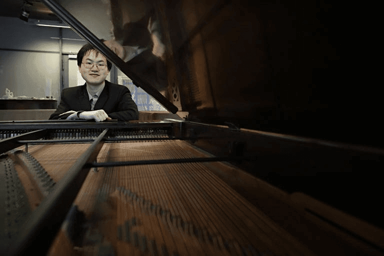Eric Guo sits at Chopin's Piano
