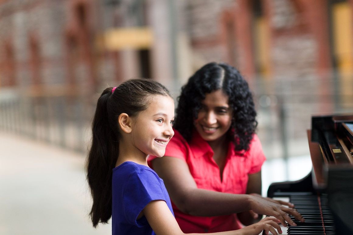kid playing piano