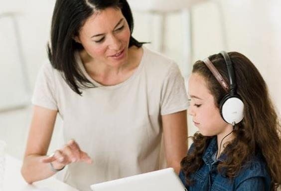 woman teaching child