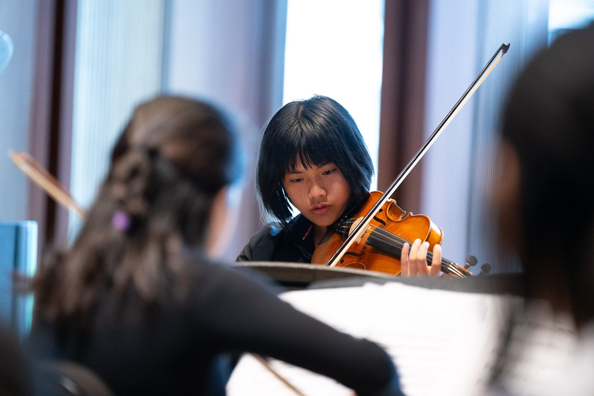 Young children playing violin
