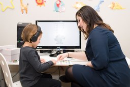 Teacher giving a lesson to child